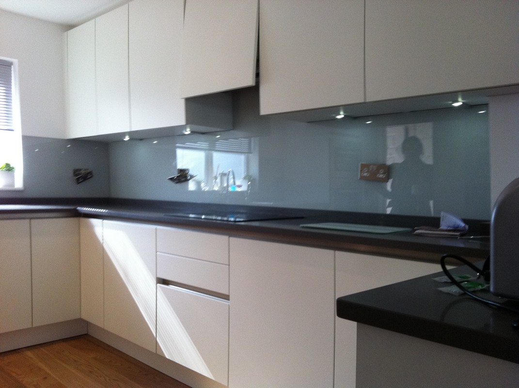 Grey glass kitchen splashback with LED lighting in Walworth