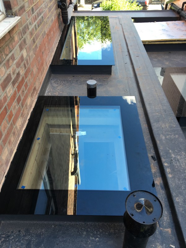 Multiple flat roof skylights on extension in Walworth