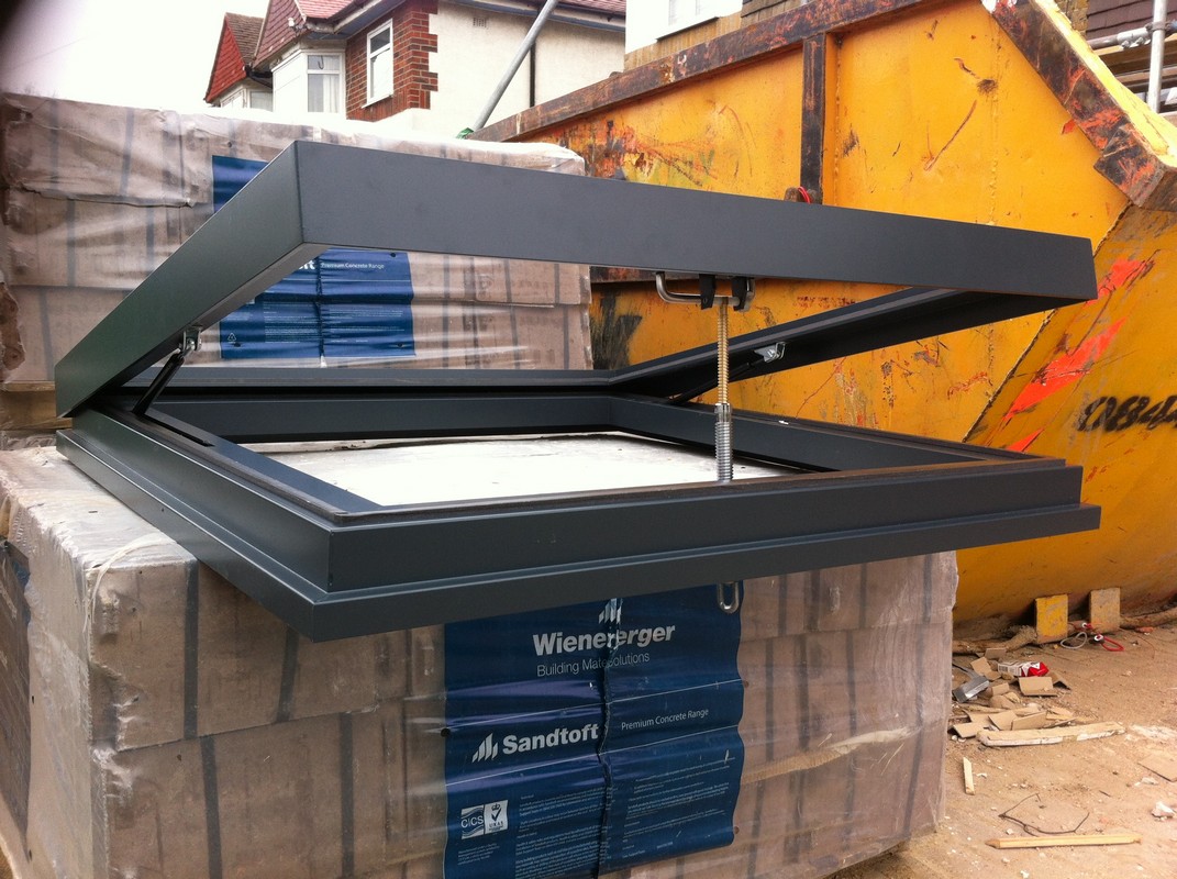Opening flat roof skylight in anthracite grey installed in Walworth